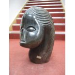 A Stylised Head, signed "L. Tak" to the reverse, 53cms high.
