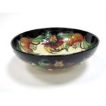 A Moorcroft Pottery Circular Bowl, tubelined and decorated in the Anna Lily design by Nicola Slaney,