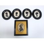 A Victorian Bronzed Silhouette Portrait of a Woman, oval, 8.2 x 6.2cms, reeded, ebonised frame; Four
