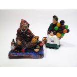 A Royal Doulton Pottery Figure, The Old Balloon Seller, HN 1315, 20cms high; Another, The Potter, HN