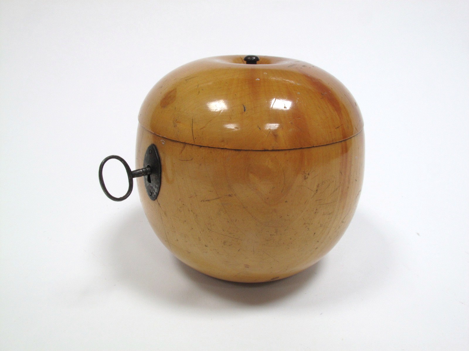 A XIX Century Fruitwood Tea Caddy, formed as an apple, with steel navette shaped lockplate, the