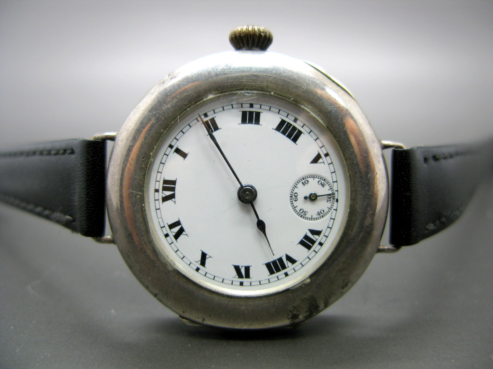 A Continental Cased Trench Style Gent's Wristwatch, the signed dial with black Roman numerals and