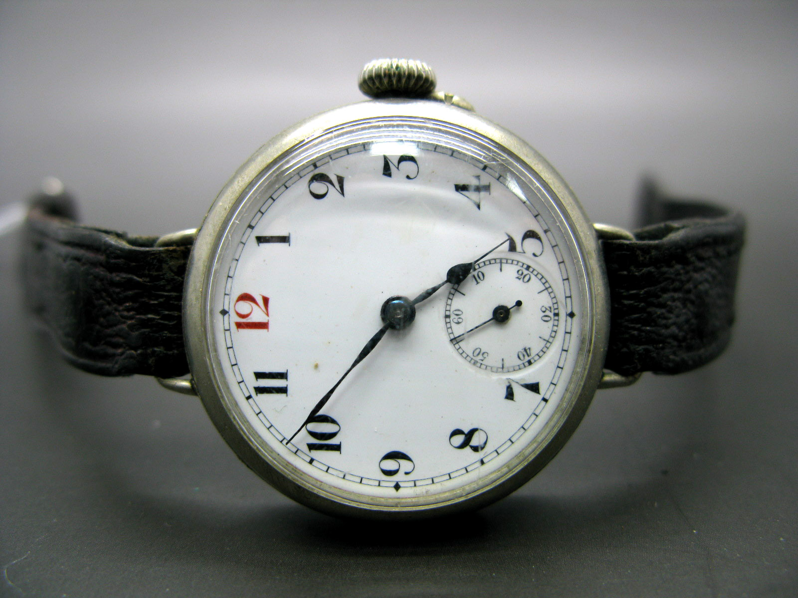 A Trench Style Gent's Wristwatch, the dial with black and red Arabic numerals and seconds subsidiary