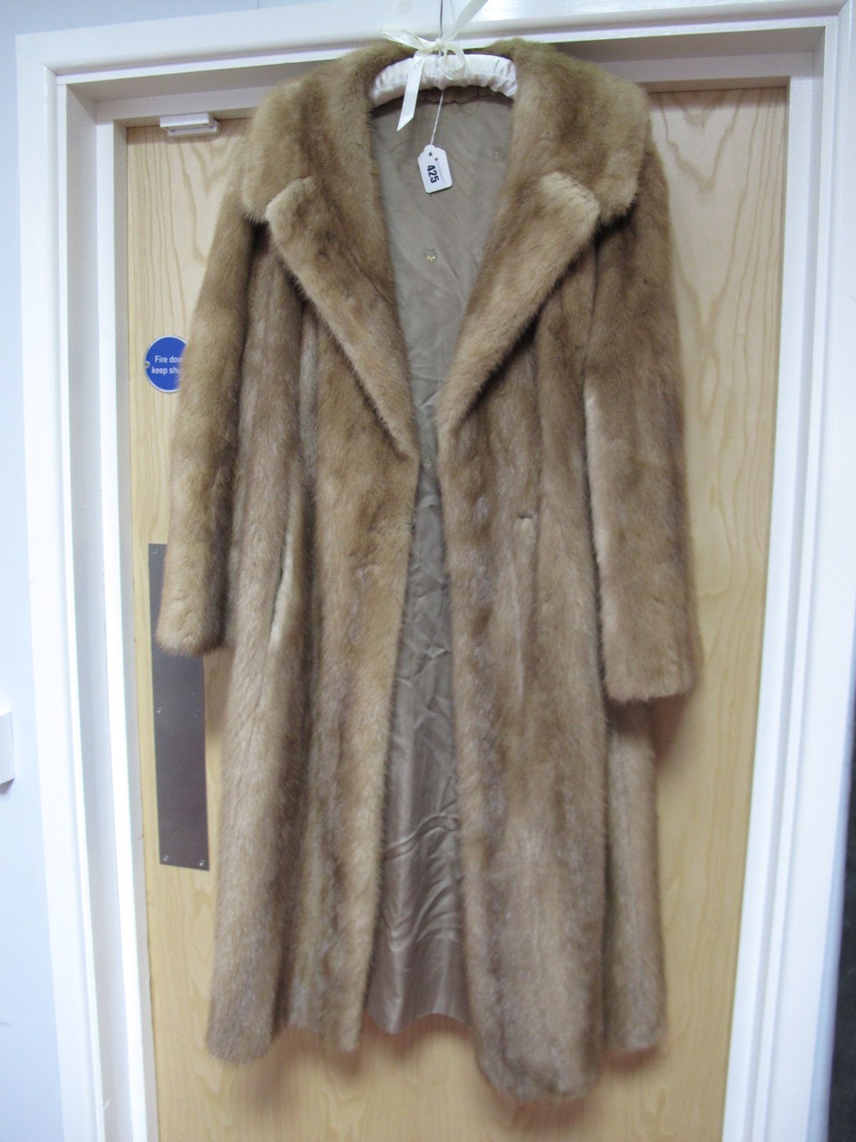 A Honey Blonde Knee Length Mink Coat, hook fastening, 106cms long.