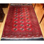 An Afghan rug, with three rows of eight