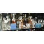 A quantity of crystal decanters, vases a