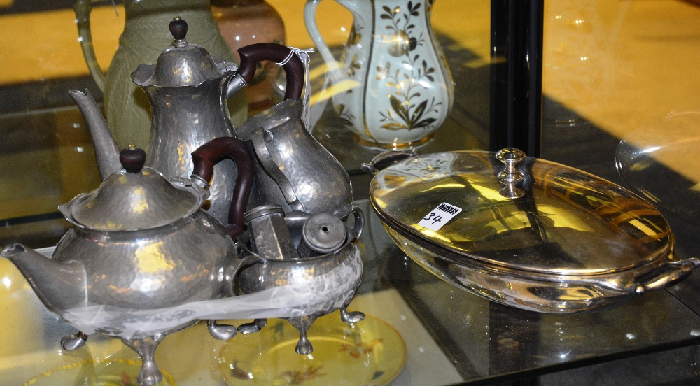 A Tudric pewter tea service, comprising teapot, coffee pot, cream and sugar, salt and pepper,