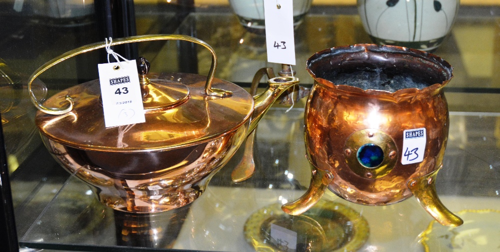 An Arts & Crafts copper tea kettle, with stylized brass handle and spout, together with an Arts &