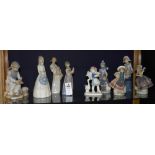 Four assorted Lladro statuettes, all app