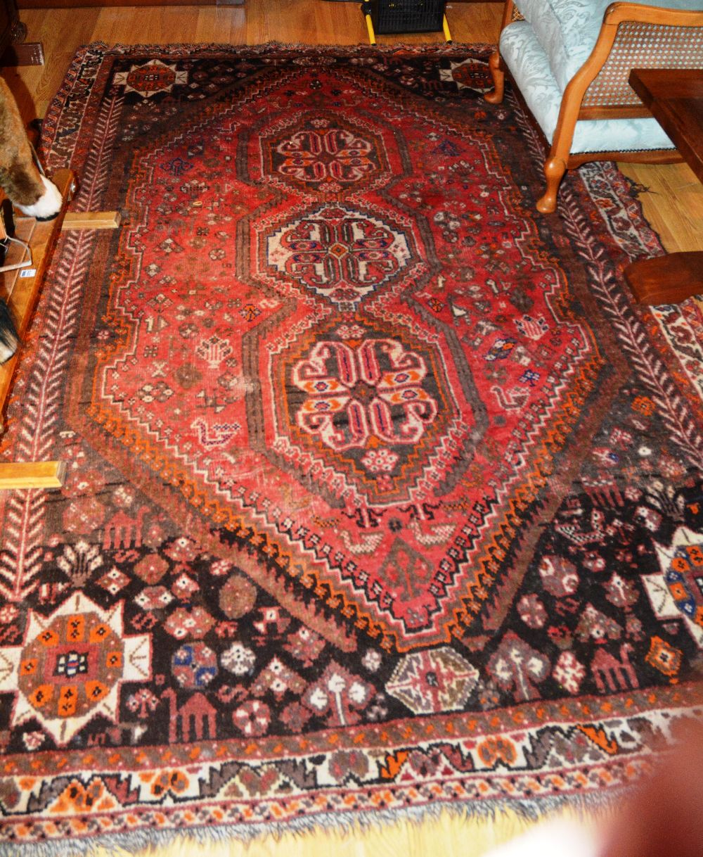 A Persian carpet with triple medallion o