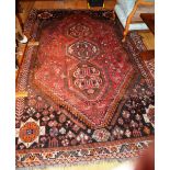 A Persian carpet with triple medallion o