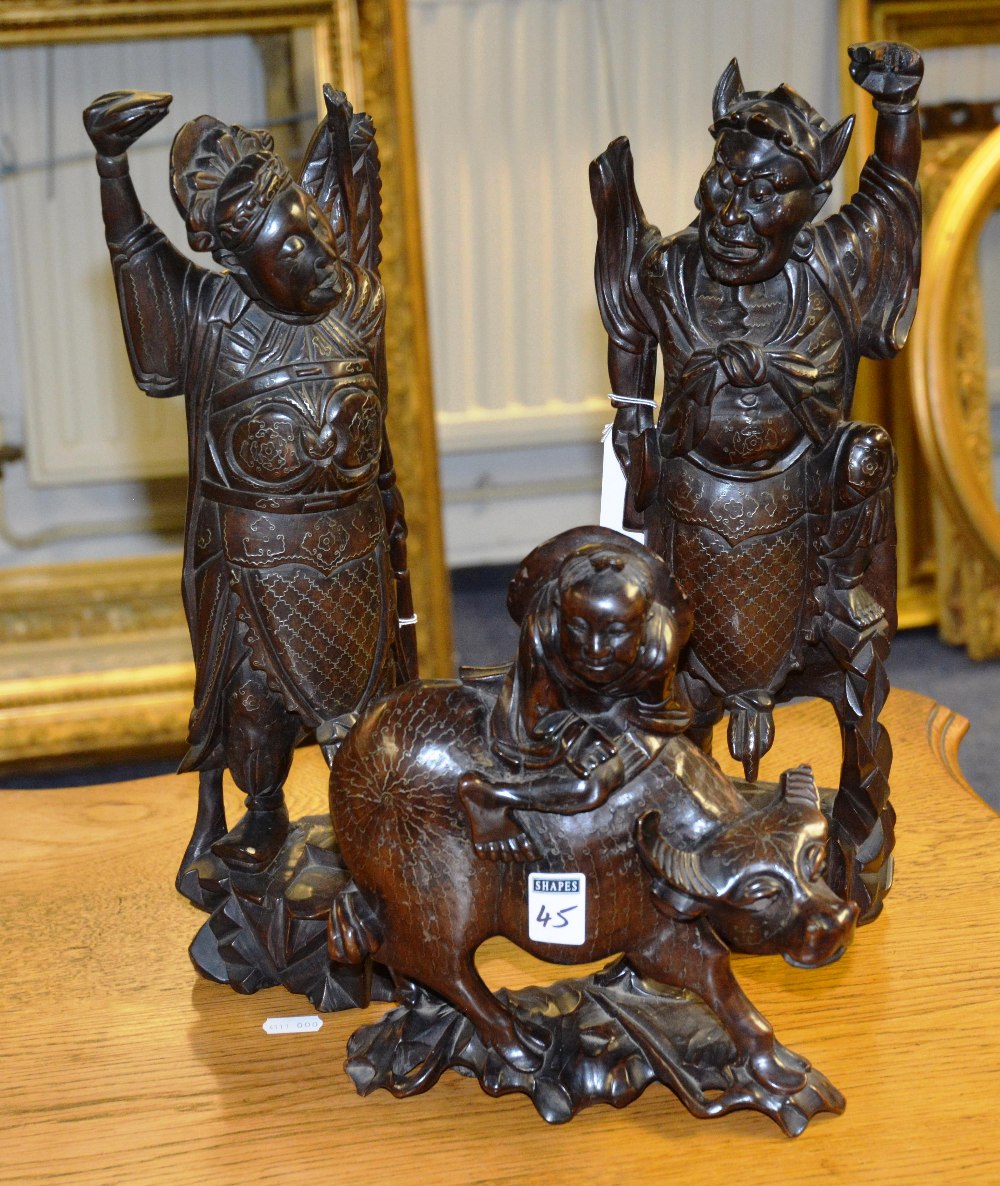 A pair of antique hardwood mythical figu