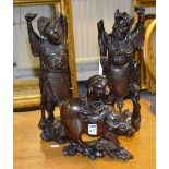 A pair of antique hardwood mythical figu