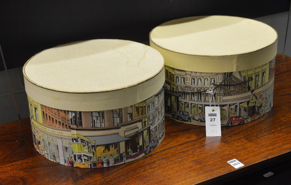 Two circular hat boxes, both with carry