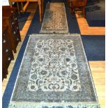 A machine made rug and runner, each with