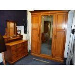 An Arts & Crafts oak wardrobe, with matc