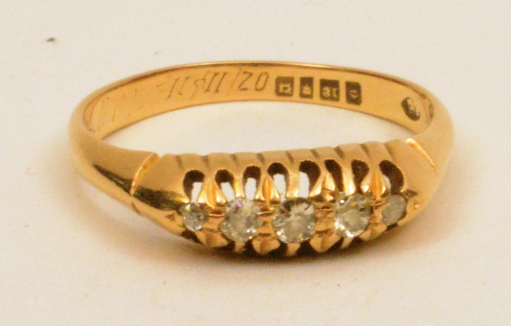 An 18ct gold five stone diamond ring, wi