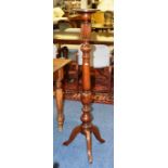 A mahogany torchere, with turned column