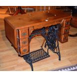 A single treadle sewing machine table, l