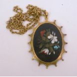 An 18ct gold pendant, depicting flowers and foliage on a black ground, 29.8g (chain alone 12.7g),
