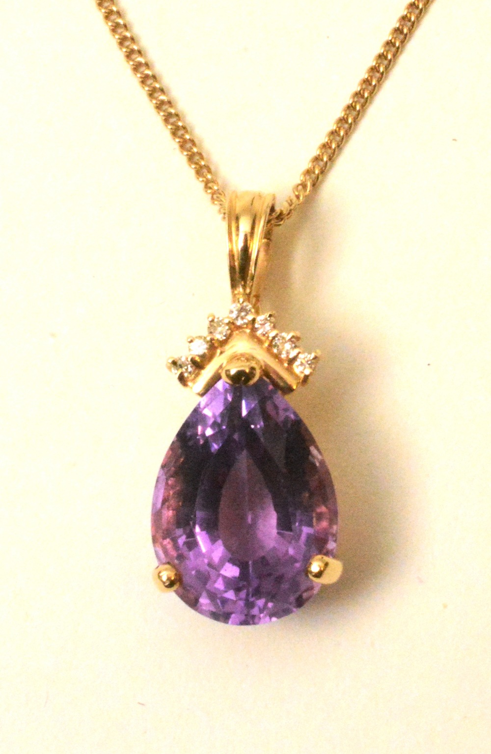 A 14ct  gold amethyst and diamond pendan