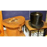 A vintage black top hat, with tan leather case, together with another black top hat, 17cm high