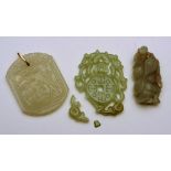 Two Chinese jade type pendants, both decorated with Chinese symbols, 6cm high, together with small