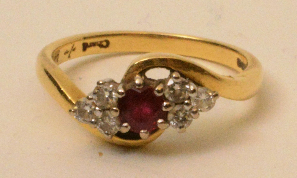 An 18ct gold ruby and diamond ring, the