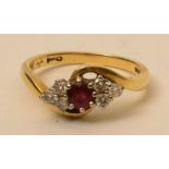 An 18ct gold ruby and diamond ring, the