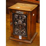 An Art Nouveau oak smokers cabinet, with