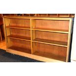 A pine low open bookcase, with open shel