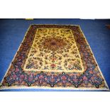 A Persian Kirman carpet, the central flo