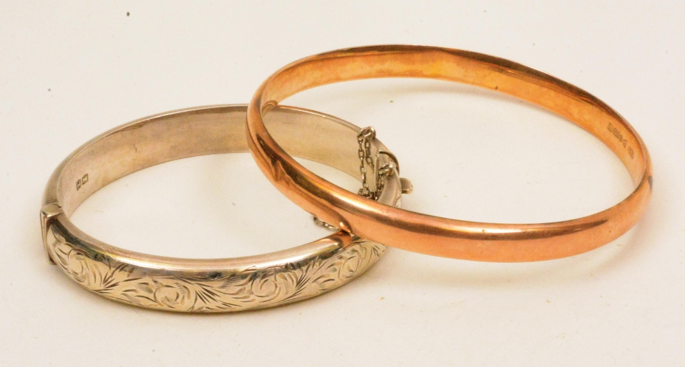 A 9ct gold rose gold bangle, 8.6g, toget