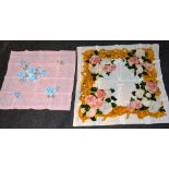 A Chanel silk scarf, depicting white and pink flowers with gold foliate detail on white ground, in