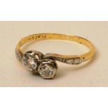 An 18ct gold and platinum two stone diam