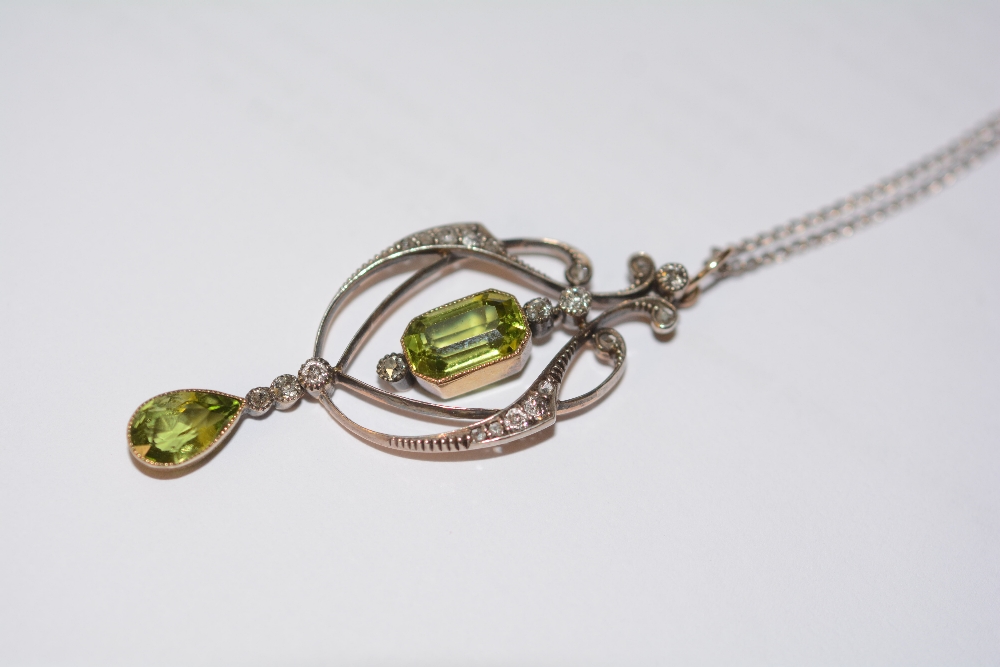 A yellow metal peridot and diamond pendant, the central emerald cut peridot drop (approx. 1.5ct) - Image 2 of 3