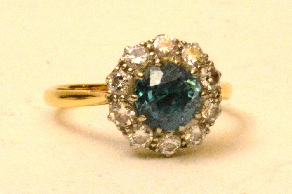 A yellow metal blue zircon and diamond flowerhead ring, the central blue topaz surrounded by 10 - Image 2 of 2