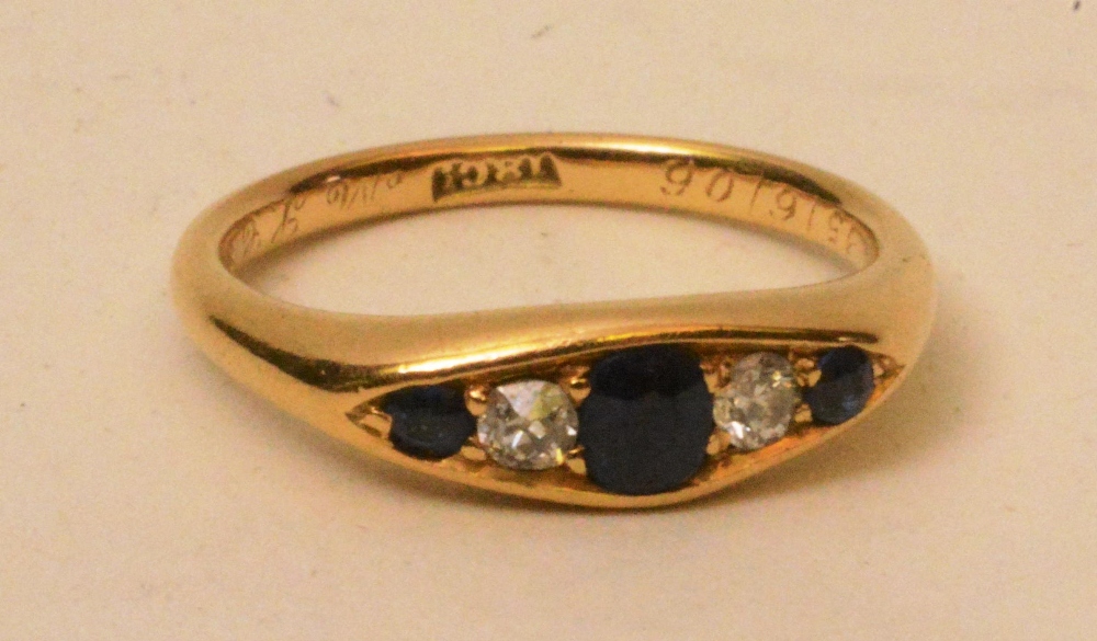 An 18ct gold sapphire and diamond five s