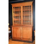 A Victorian glazed two door bookcase, with moulded cornice above two glazed astragal doors,