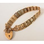 A 9ct gold brick link padlock bracelet, 15.