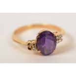A yellow metal amethyst and diamond ring,