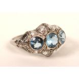 A white metal aquamarine and diamond ring,