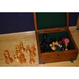 A near complete set of boxwood and ebony weighted Jaques chess pieces, with red crown stamp to rook,