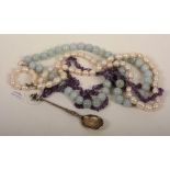 A string of baroque pearls, with silver clasp, 37cm long,