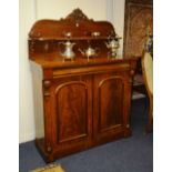 A Victorian mahogany chiffonier, with shelved gallery back decorated with fruit and vine scrolls,