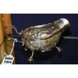 A late Victorian silver sauce boat, Dublin 1899 by Charles Lambe, with allover foliate decoration,
