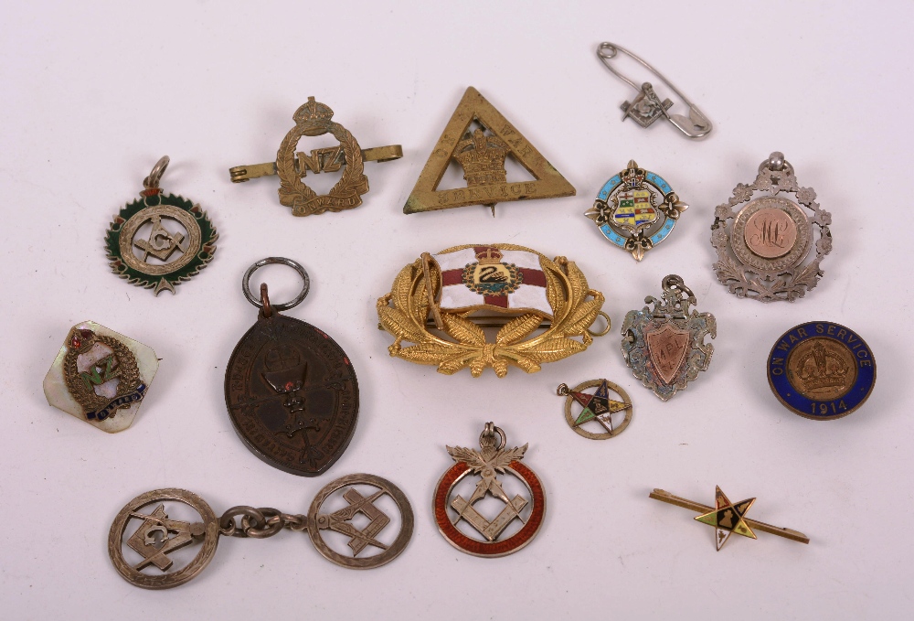 A quantity of silver medals and badges, to include Masonic, NZ Onward,