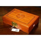 A modern Chinese hardwood jewellery box, with carved symbol to hinged top,