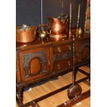 A quantity of copper and brass wares, to include coal depot, fender, jelly pan,