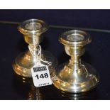 A pair of silver Elizabeth II squat candlesticks, Birmingham 1967 by C&C,